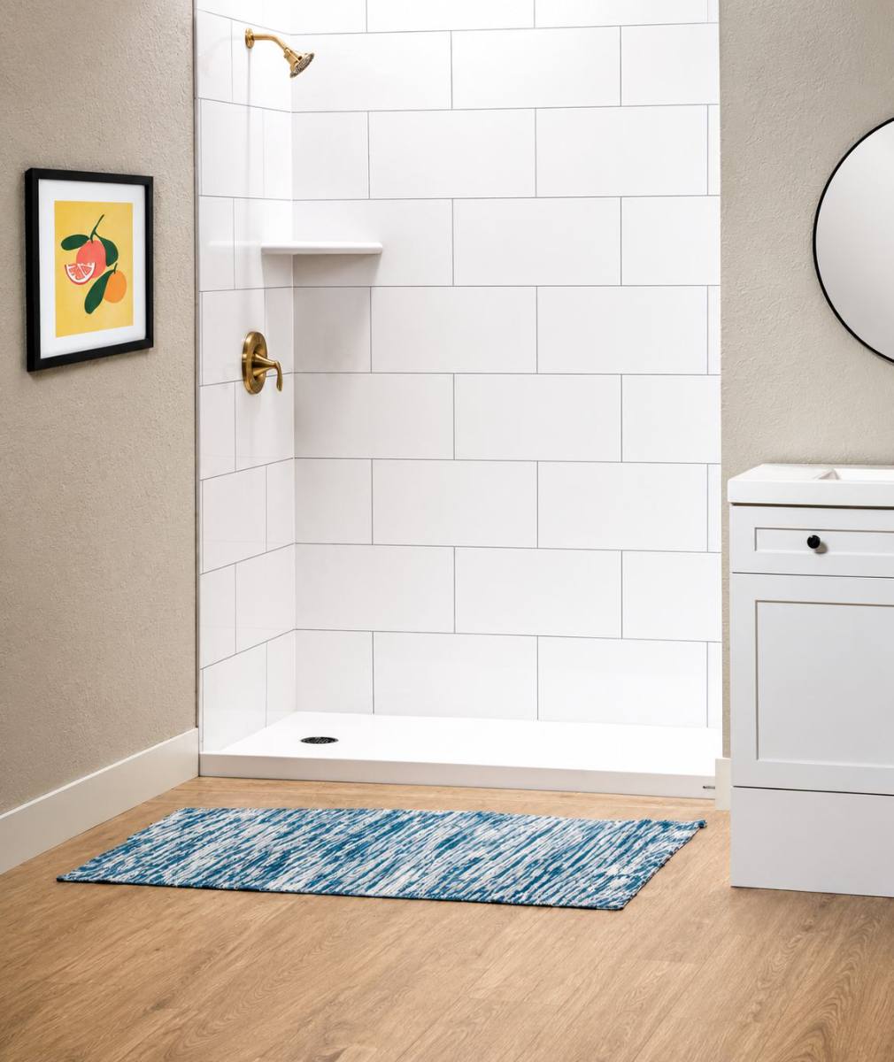 White SimTile shower with gold fixtures